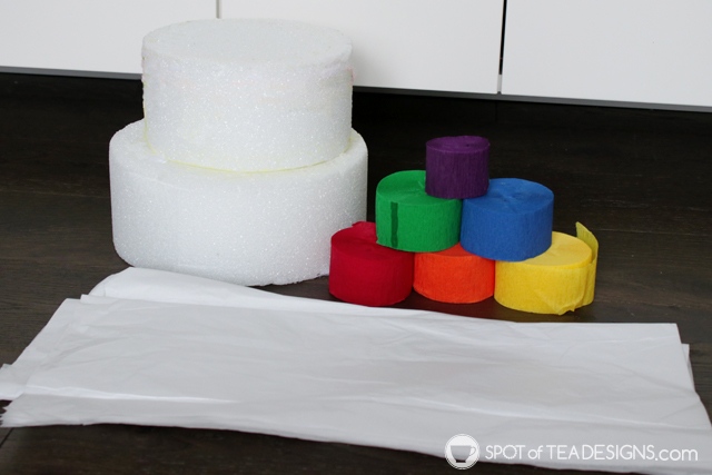 DIY rainbow lollipop holder - an easy way to display candy on your dessert table | spotofteadesigns.com