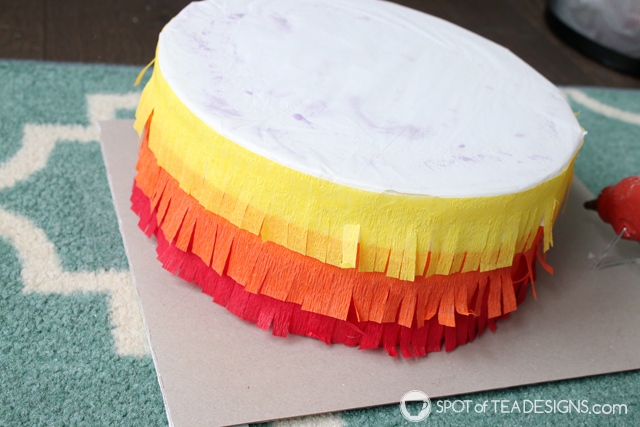 DIY rainbow lollipop holder - an easy way to display candy on your dessert table | spotofteadesigns.com