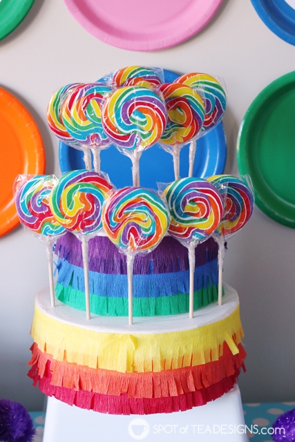 DIY rainbow lollipop holder - an easy way to display candy on your dessert table | spotofteadesigns.com