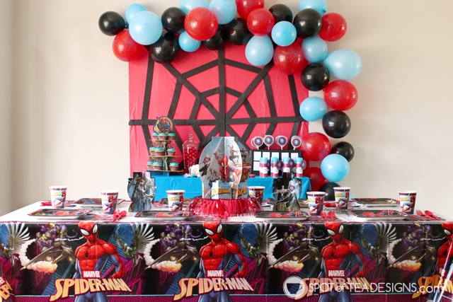 5+ budget friendly spider-man party hacks - crepe streamers to create spider web backdrop | spotofteadesigns.com