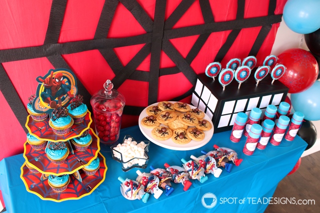 5+ budget friendly spider-man party hacks - lollipop stand is box wrapped in black tablecloth and white cardstock pieces | spotofteadesigns.com