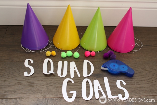 Squad goals party hat centerpiece idea for kids birthday party, complete with free SVG file for this font matching a "Selfie Celebration" party line | spotofteadesigns.com