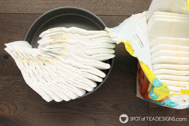 How to make a diaper cake for a baby shower without rollling diapers and using rubber bands | spotofteadesigns.com