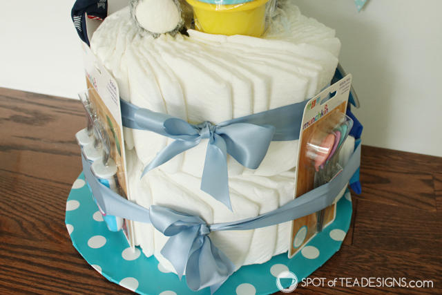 How to make a diaper cake for a baby shower without rollling diapers and using rubber bands | spotofteadesigns.com